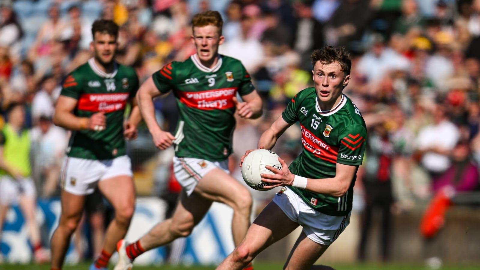 Mayo player running with the ball during match Mayo player running with the ball during match