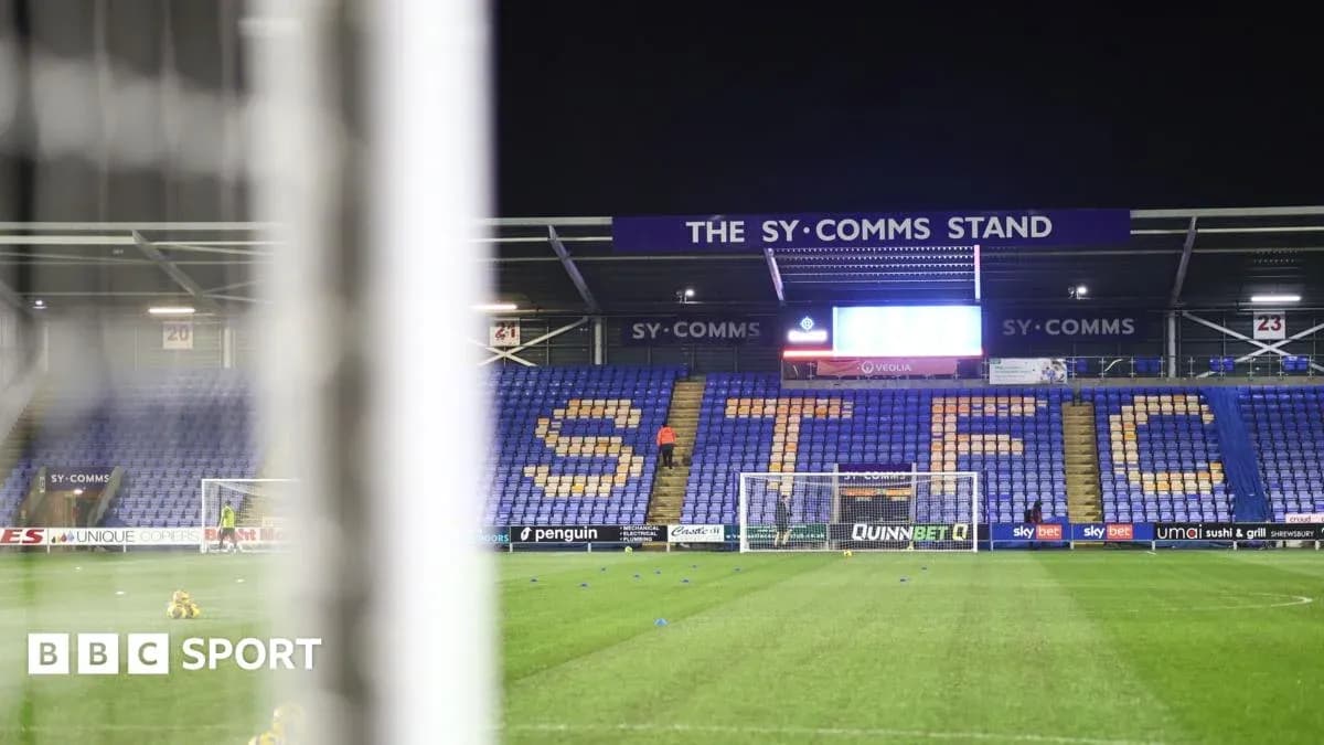Shrewsbury Town stadium with goal and stands visible Shrewsbury Town stadium with goal and stands visible
