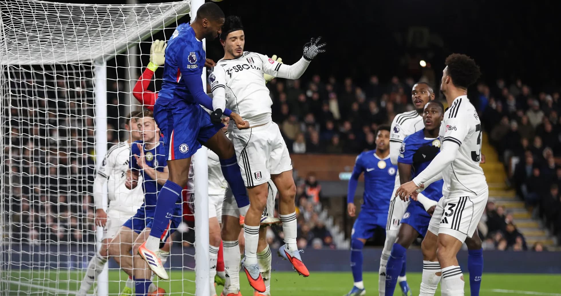 Fulham and Chelsea players contesting a corner Fulham and Chelsea players contesting a corner