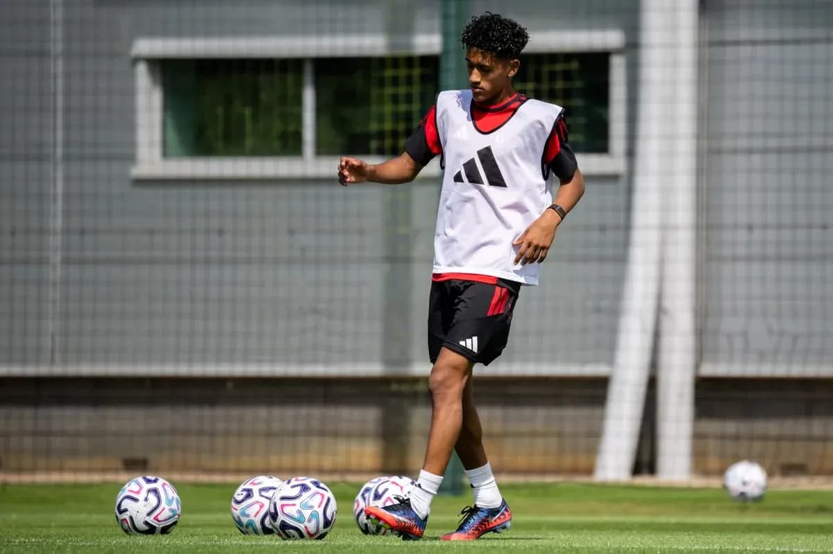 Player training on pitch with multiple soccer balls Player training on pitch with multiple soccer balls