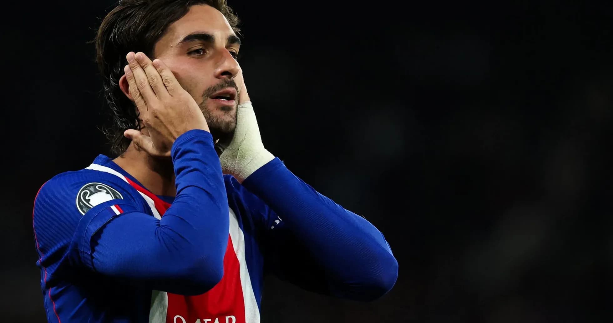 Player holding his face during a match Player holding his face during a match