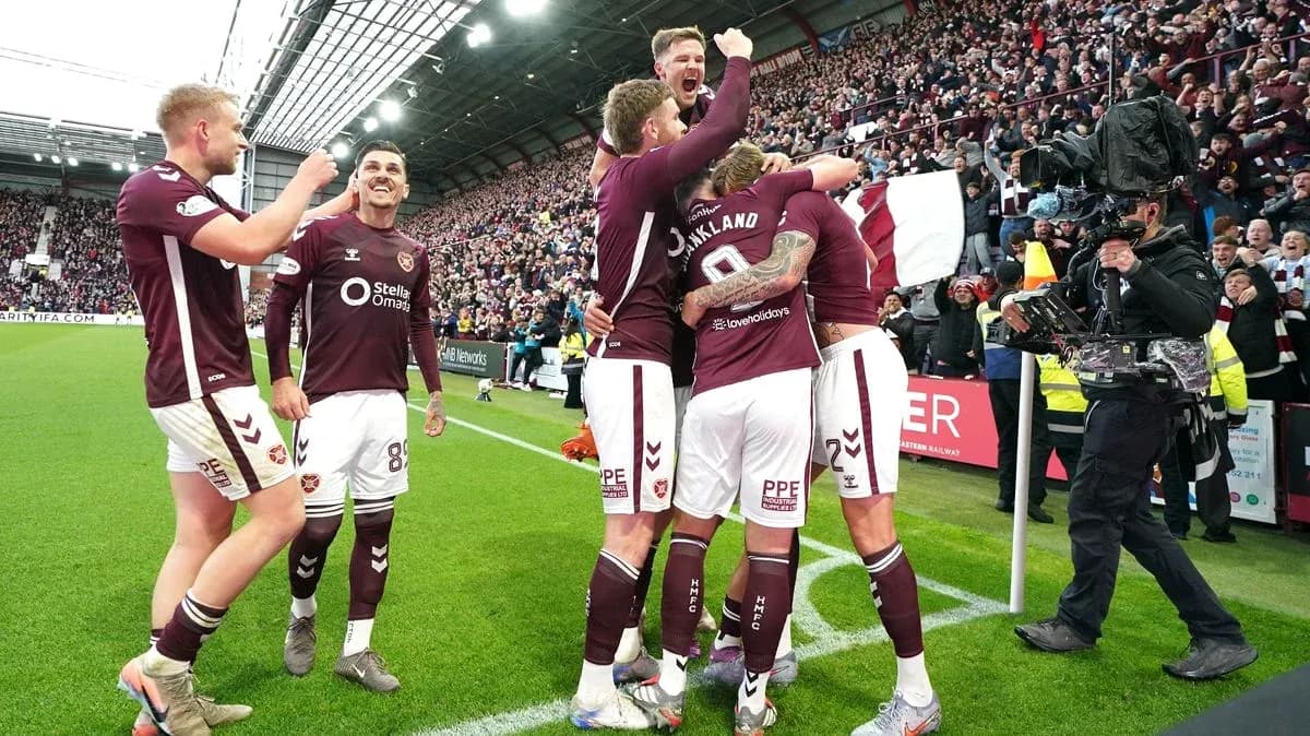 Hearts players celebrating a goal at Tynecastle Hearts players celebrating a goal at Tynecastle