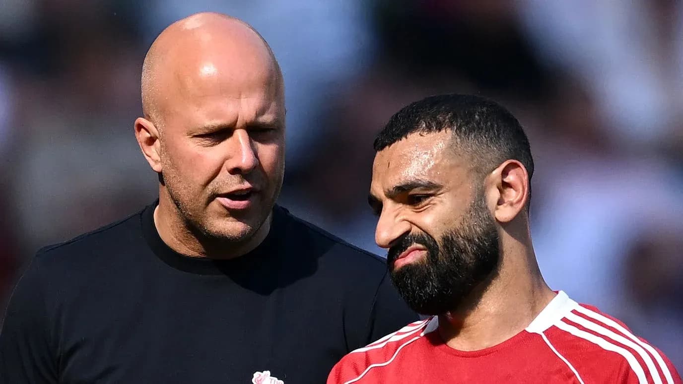 Two men discussing on the field after match Two men discussing on the field after match