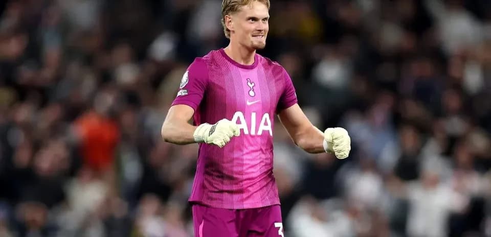 Goalkeeper celebrating in pink kit during match Goalkeeper celebrating in pink kit during match
