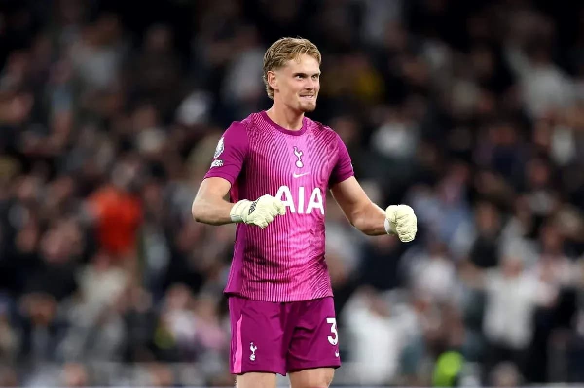 Goalkeeper celebrating in pink kit during match Goalkeeper celebrating in pink kit during match
