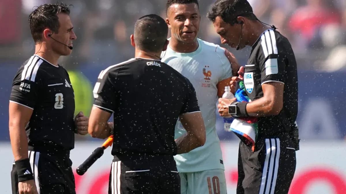 Referees discussing with player during match Referees discussing with player during match