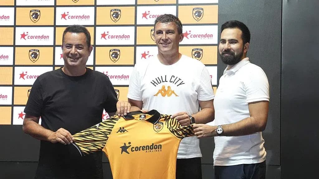 New manager holding Hull City jersey at announcement New manager holding Hull City jersey at announcement