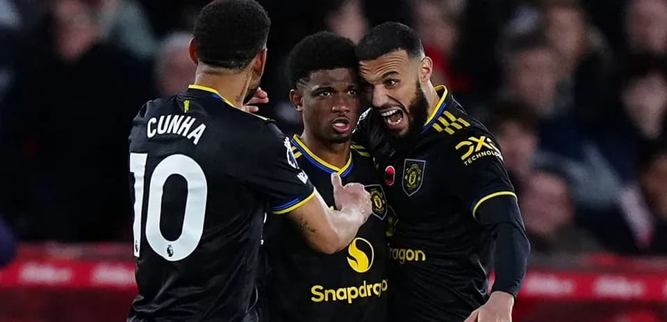 Manchester United players celebrating a goal Manchester United players celebrating a goal