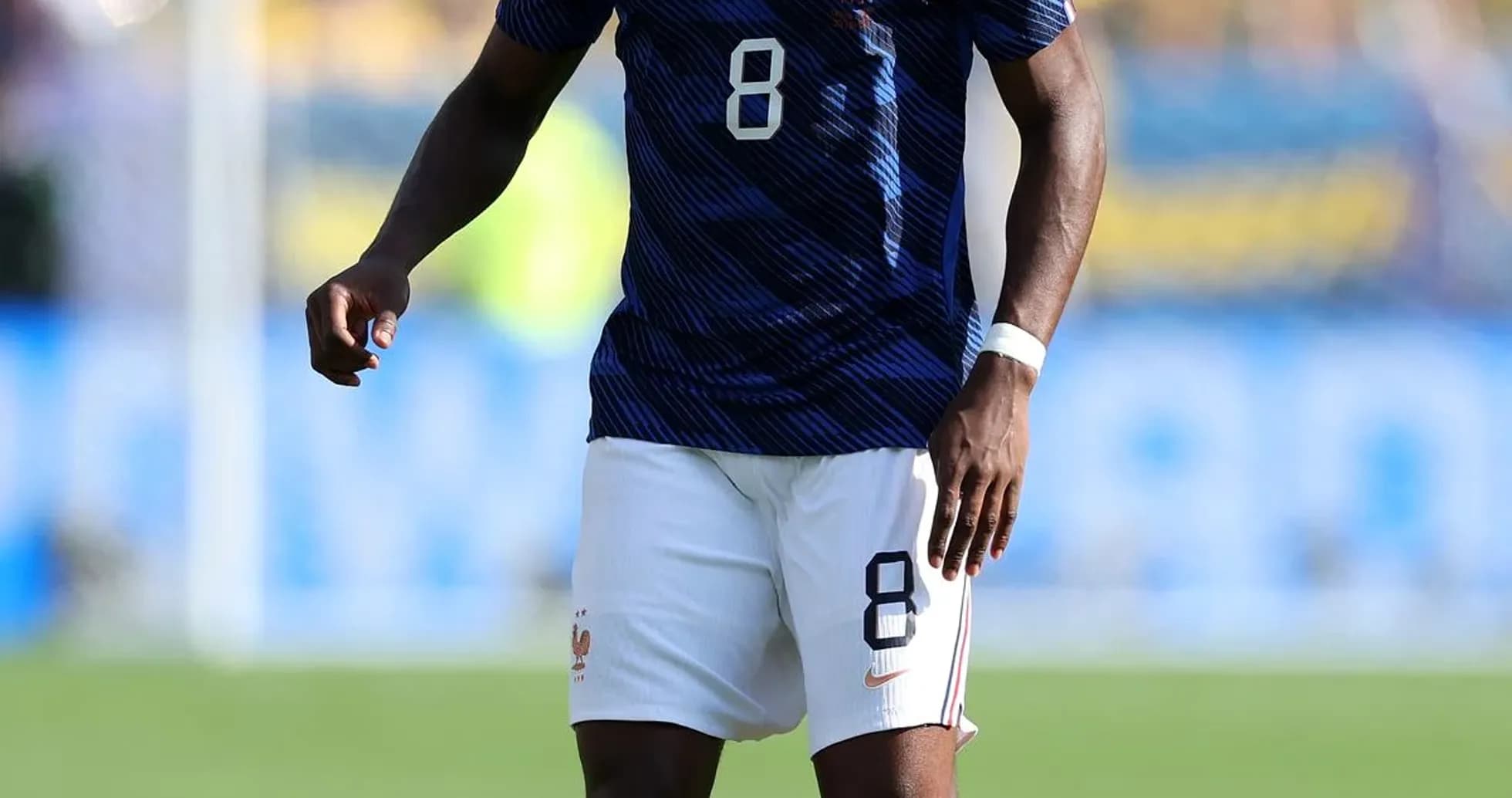 Player in France kit with ball on field Player in France kit with ball on field