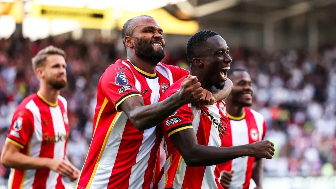 Brentford players celebrating a goal on the pitch Brentford players celebrating a goal on the pitch