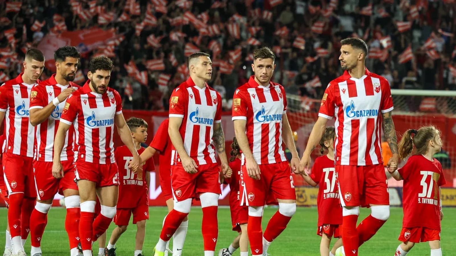 FK Crvena Zvezda players walking onto the field FK Crvena Zvezda players walking onto the field
