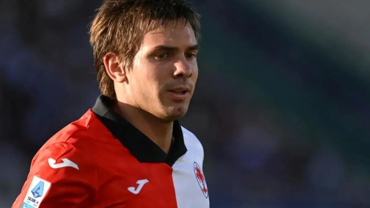 Player in red and white jersey during match Player in red and white jersey during match