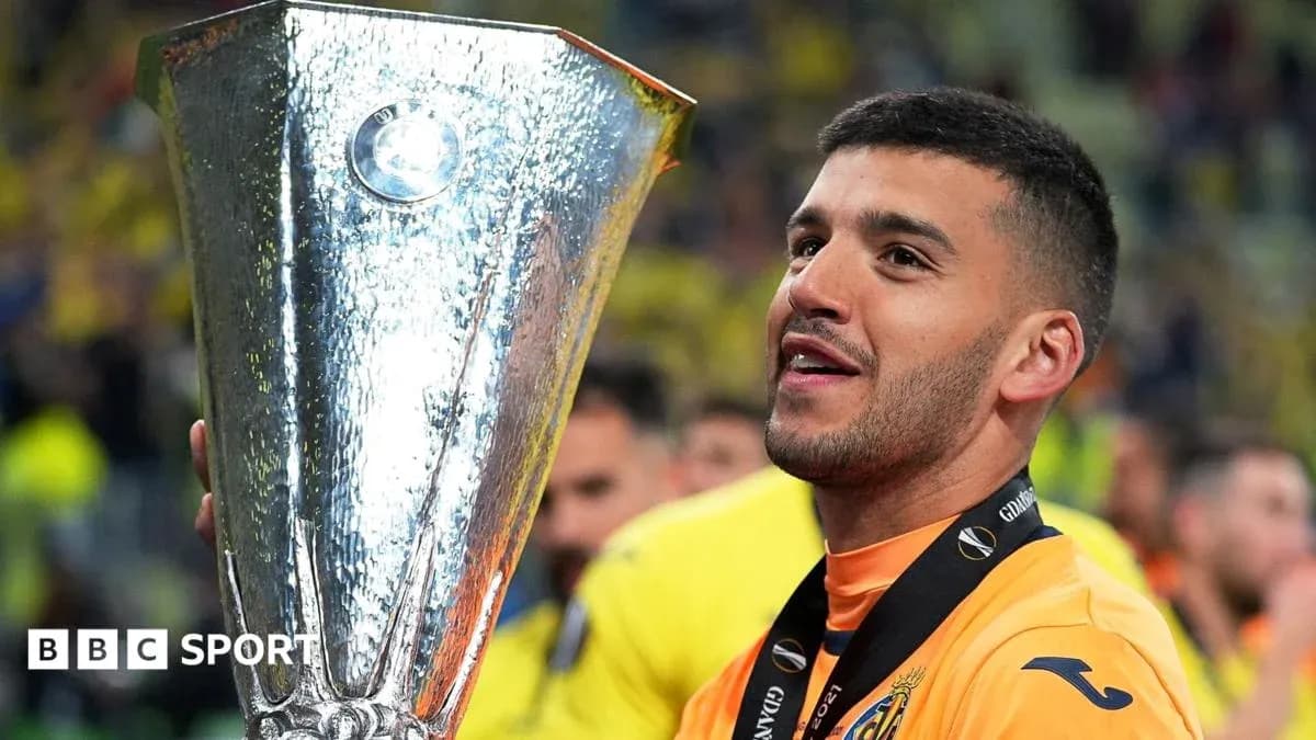 Player holding UEFA Europa League trophy after victory Player holding UEFA Europa League trophy after victory