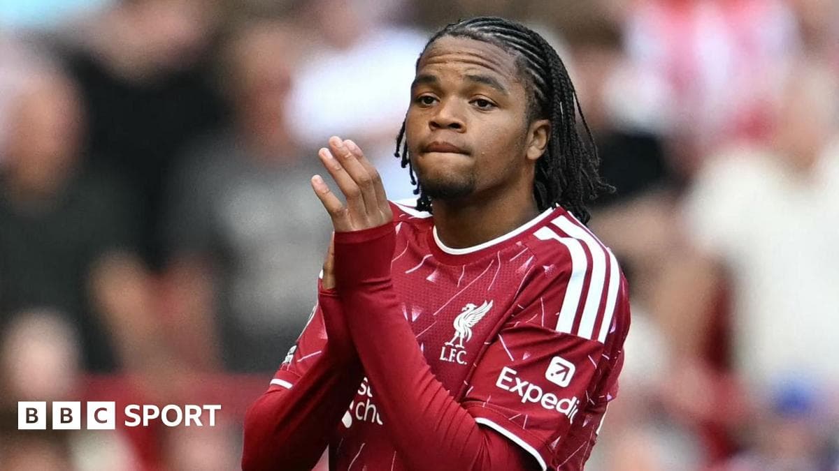 Player in Liverpool jersey applauding fans Player in Liverpool jersey applauding fans
