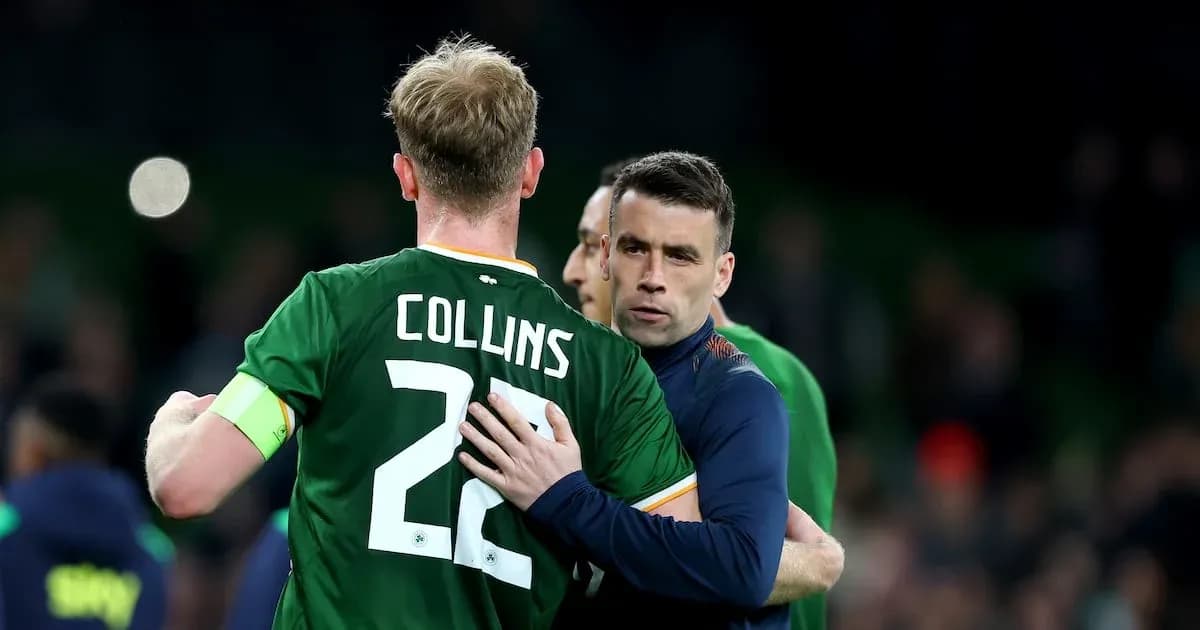 Two players embracing after a match on the field Two players embracing after a match on the field