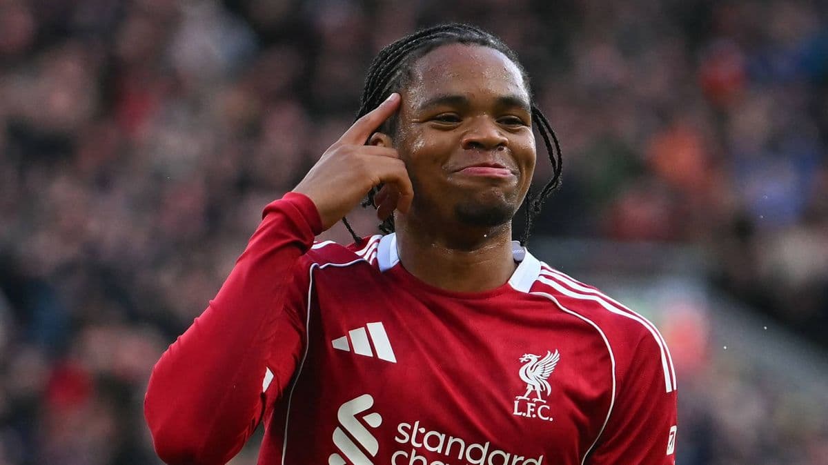 Player celebrating with finger gesture on pitch Player celebrating with finger gesture on pitch