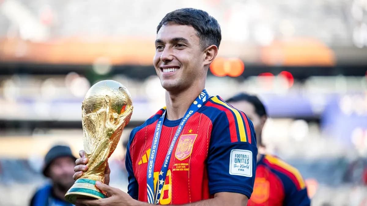 Player celebrating with FIFA World Cup trophy Player celebrating with FIFA World Cup trophy
