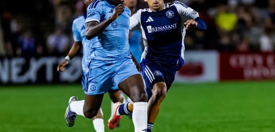 Player sprinting with ball during match Player sprinting with ball during match