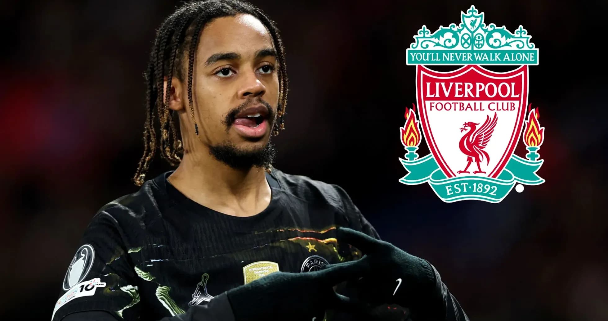Player gesturing with Liverpool logo in background Player gesturing with Liverpool logo in background