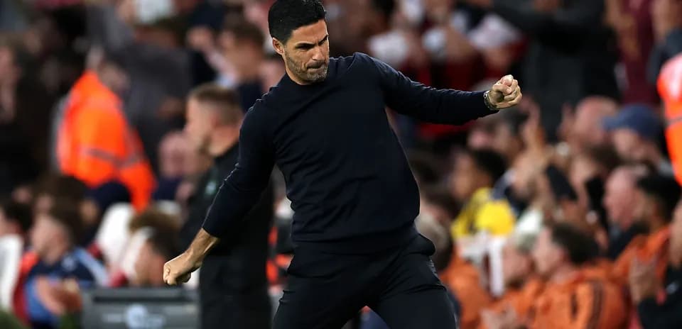 Manager celebrating during a match with fans Manager celebrating during a match with fans