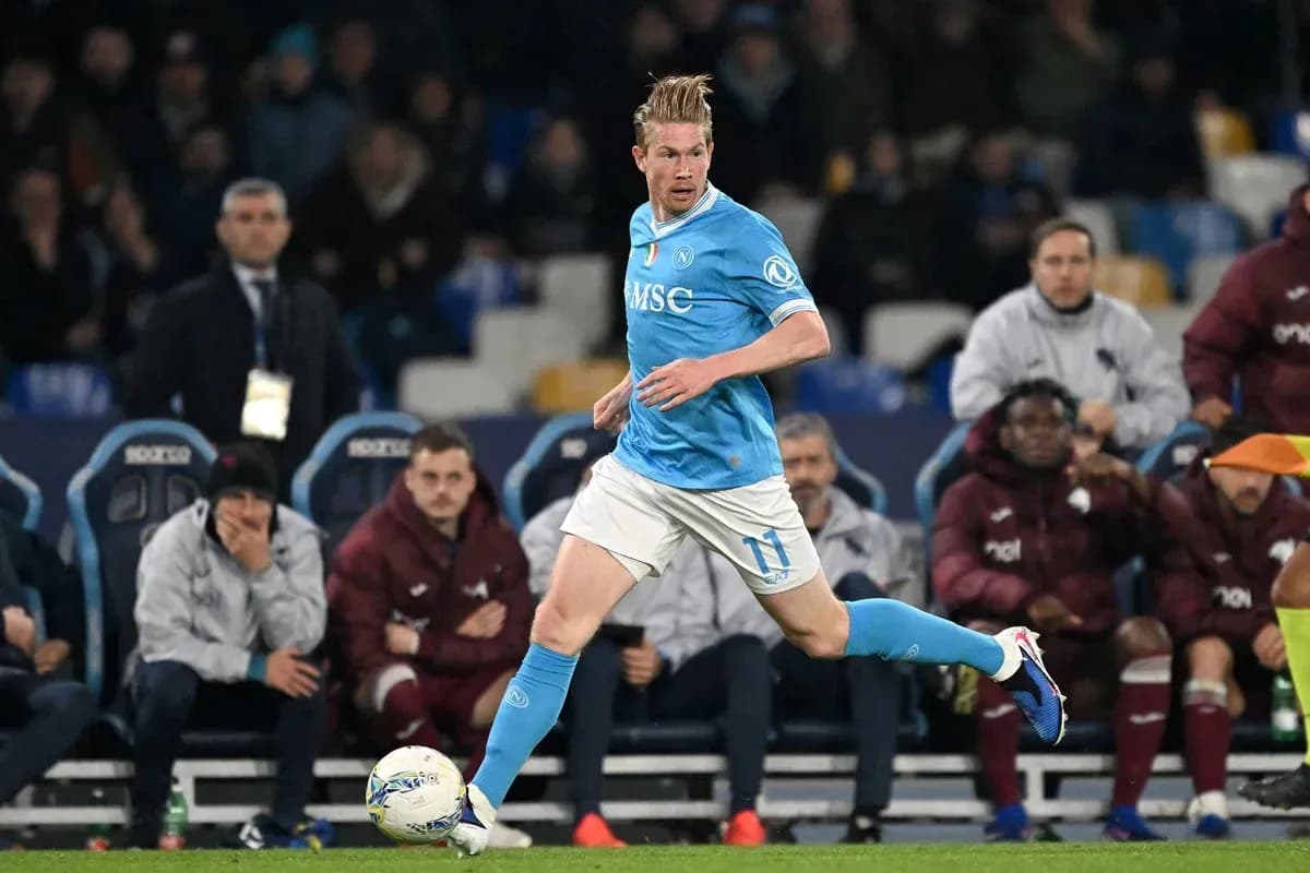Player in blue jersey dribbling ball during match Player in blue jersey dribbling ball during match