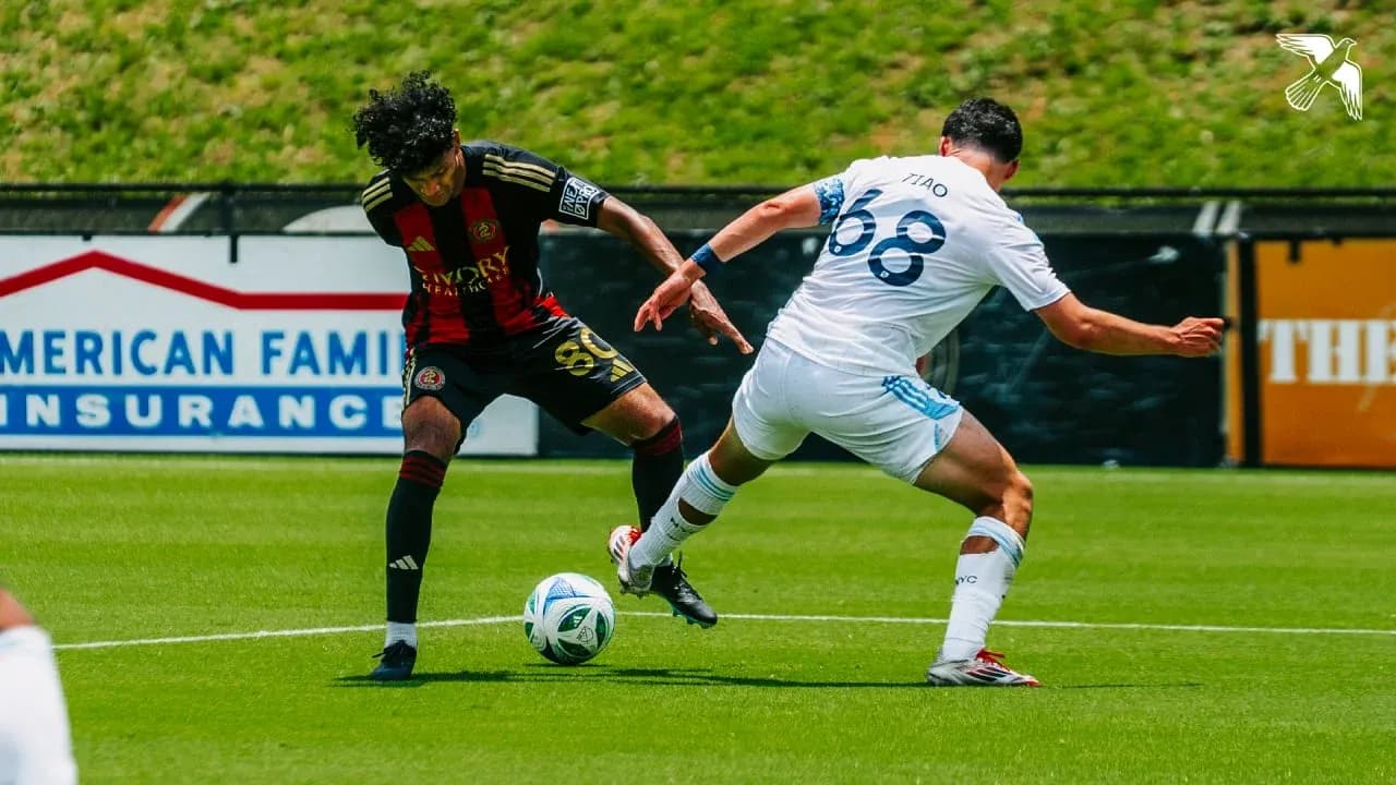 Atlanta United II player challenging New York City II opponent Atlanta United II player challenging New York City II opponent