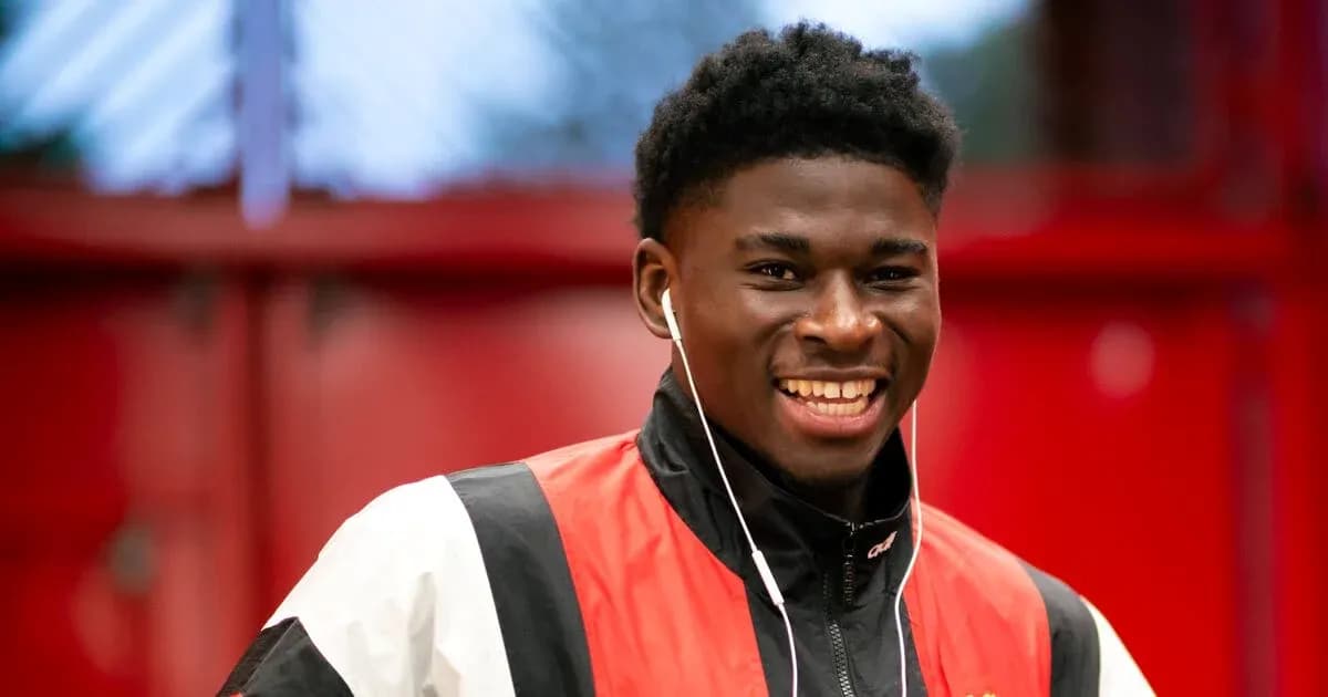 Player smiling while wearing headphones indoors Player smiling while wearing headphones indoors