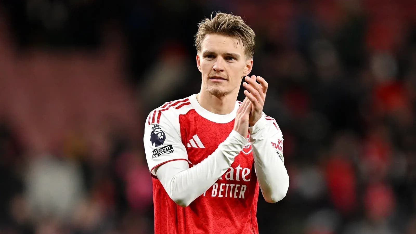 Player applauding fans after match wearing Arsenal kit Player applauding fans after match wearing Arsenal kit