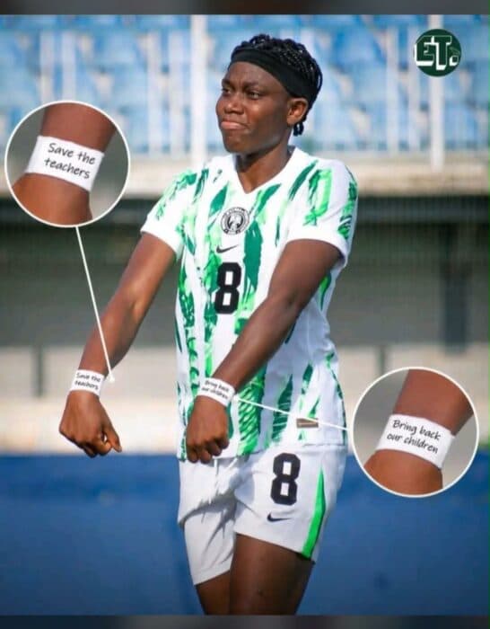 Football player displaying solidarity wristbands during match Football player displaying solidarity wristbands during match