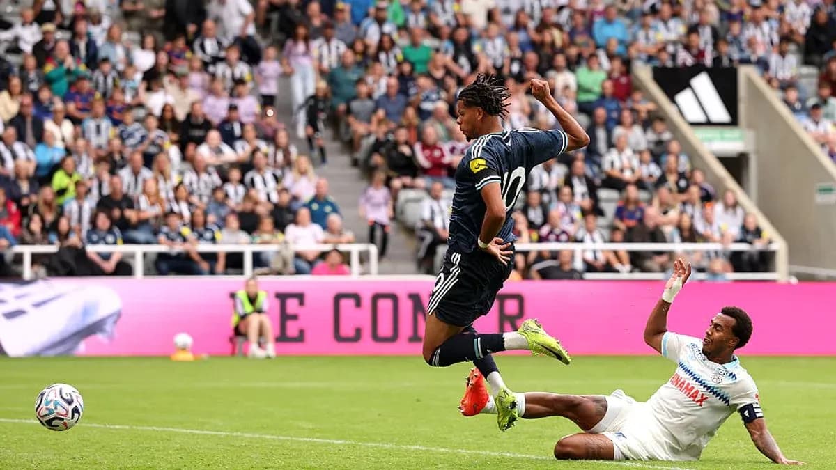 Player evading a tackle during a football match Player evading a tackle during a football match