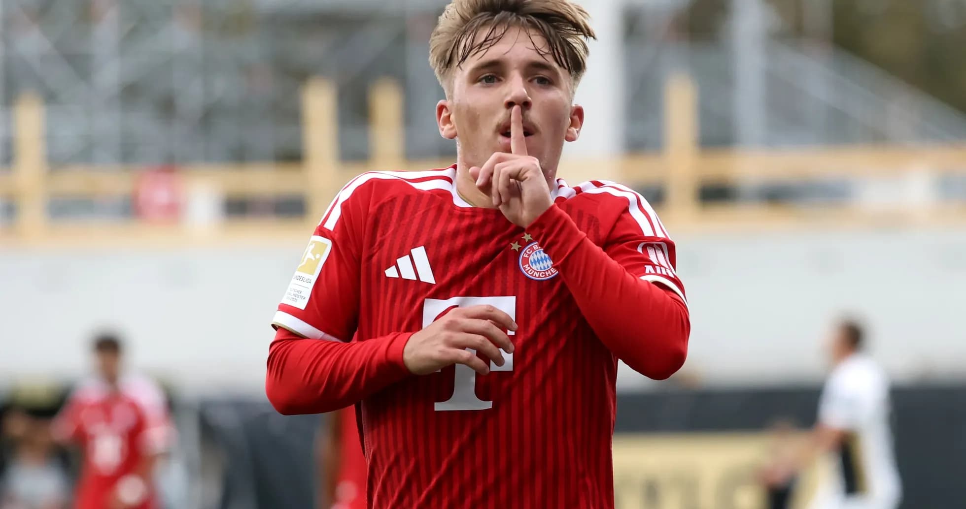 Player celebrating goal with shushing gesture Player celebrating goal with shushing gesture