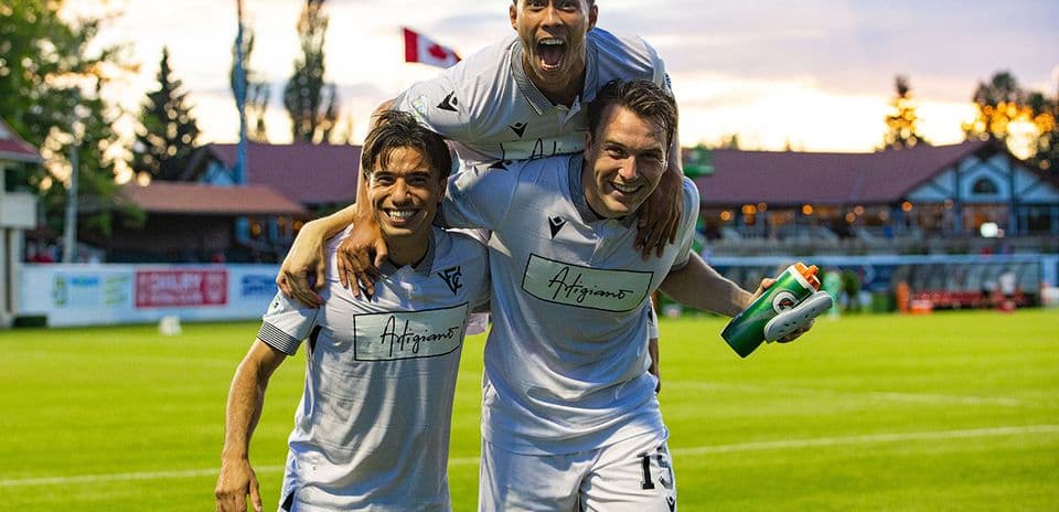 Vancouver FC players celebrating on the field Vancouver FC players celebrating on the field