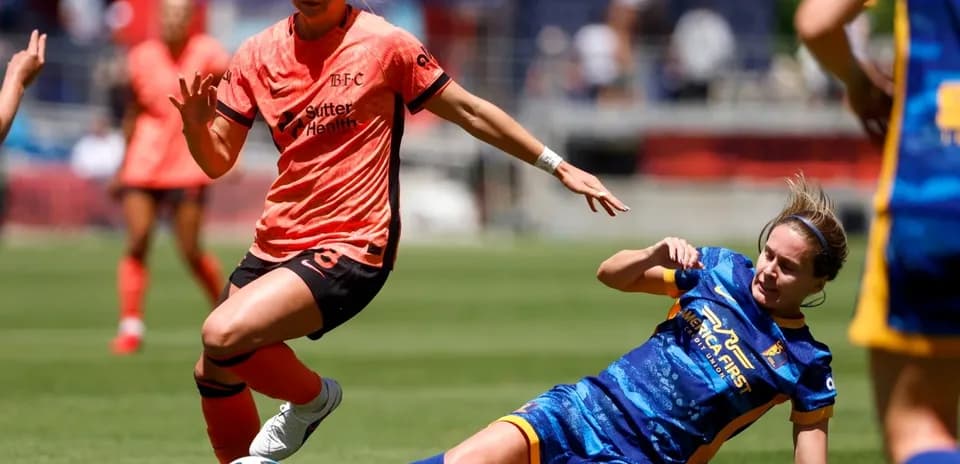 Bay FC player dribbling past Utah Royals defender Bay FC player dribbling past Utah Royals defender