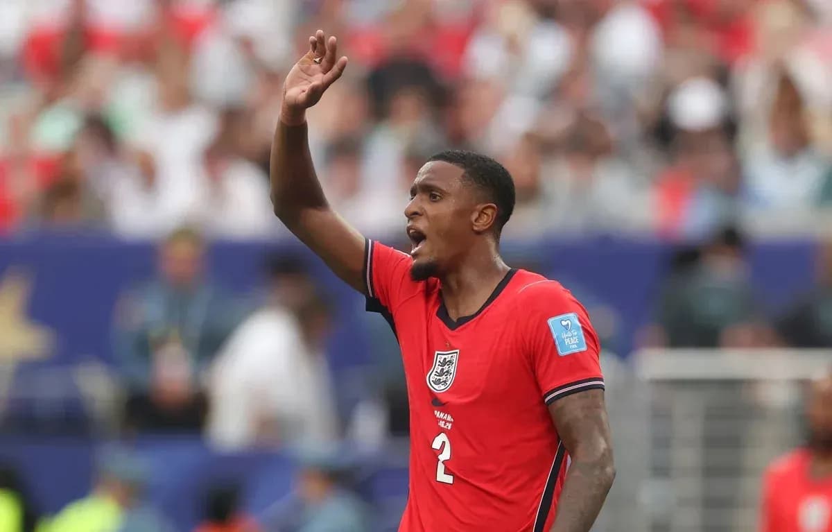 Player gesturing during a match in red jersey Player gesturing during a match in red jersey
