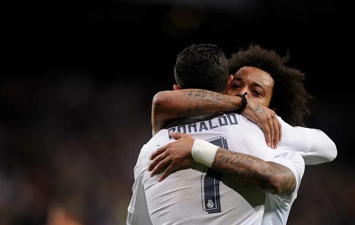 Cristiano Ronaldo and Marcelo embracing after a goal Cristiano Ronaldo and Marcelo embracing after a goal