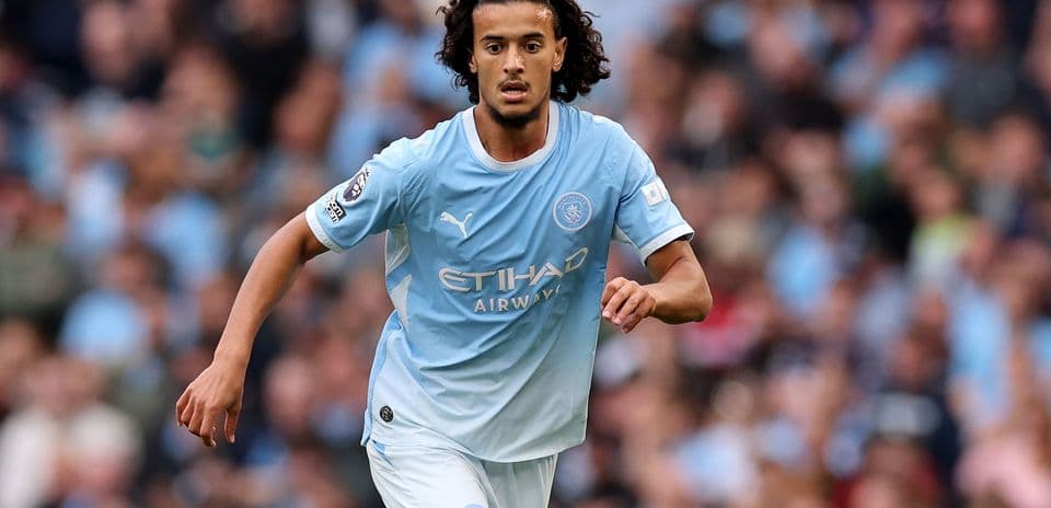 Player in blue kit running during a match Player in blue kit running during a match