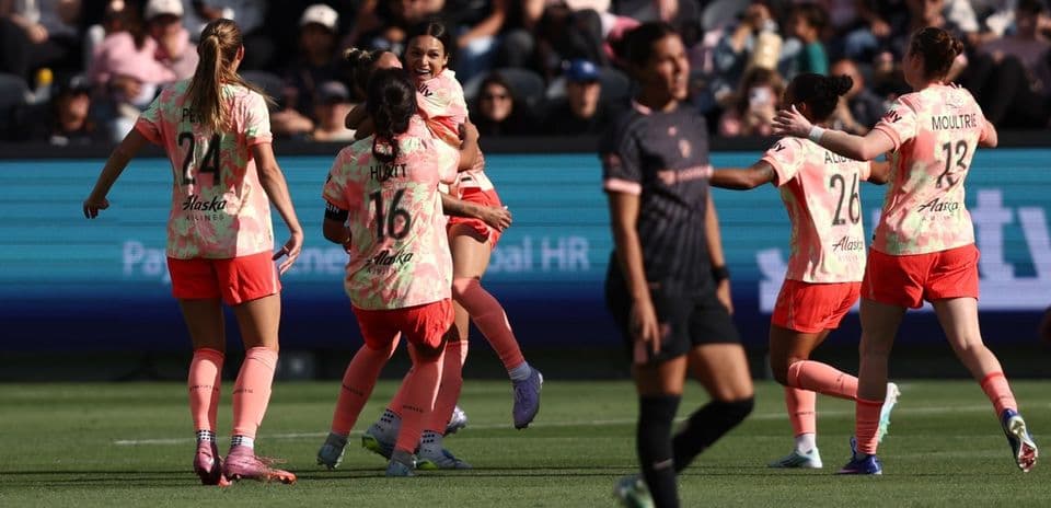 Portland Thorns players celebrating a goal Portland Thorns players celebrating a goal