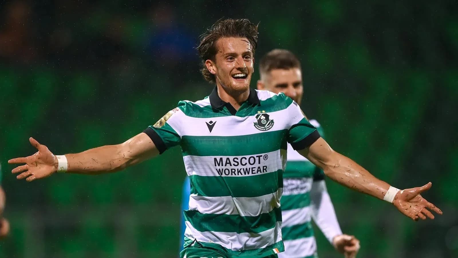 Player celebrating a goal in team uniform Player celebrating a goal in team uniform