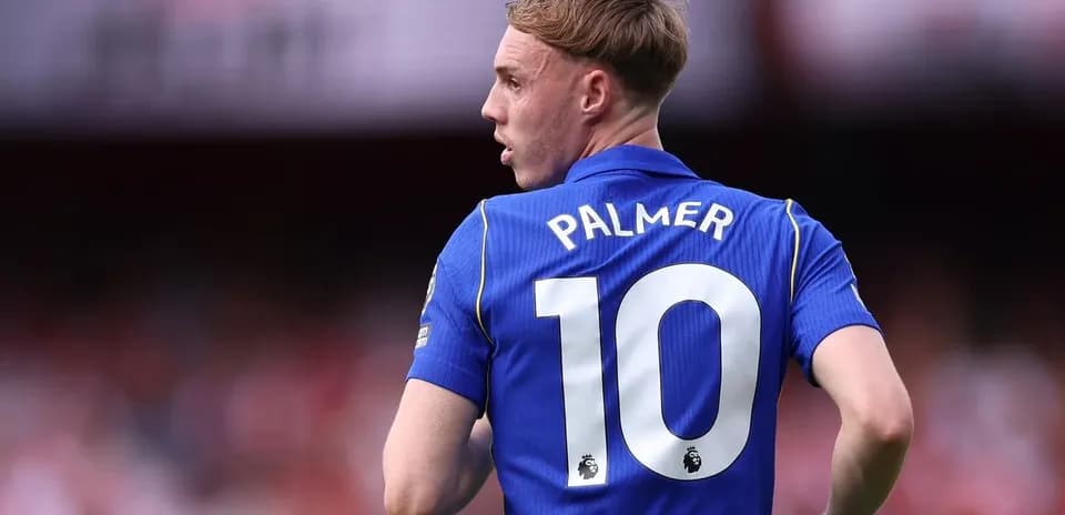 Player in blue jersey with number 10 on back Player in blue jersey with number 10 on back