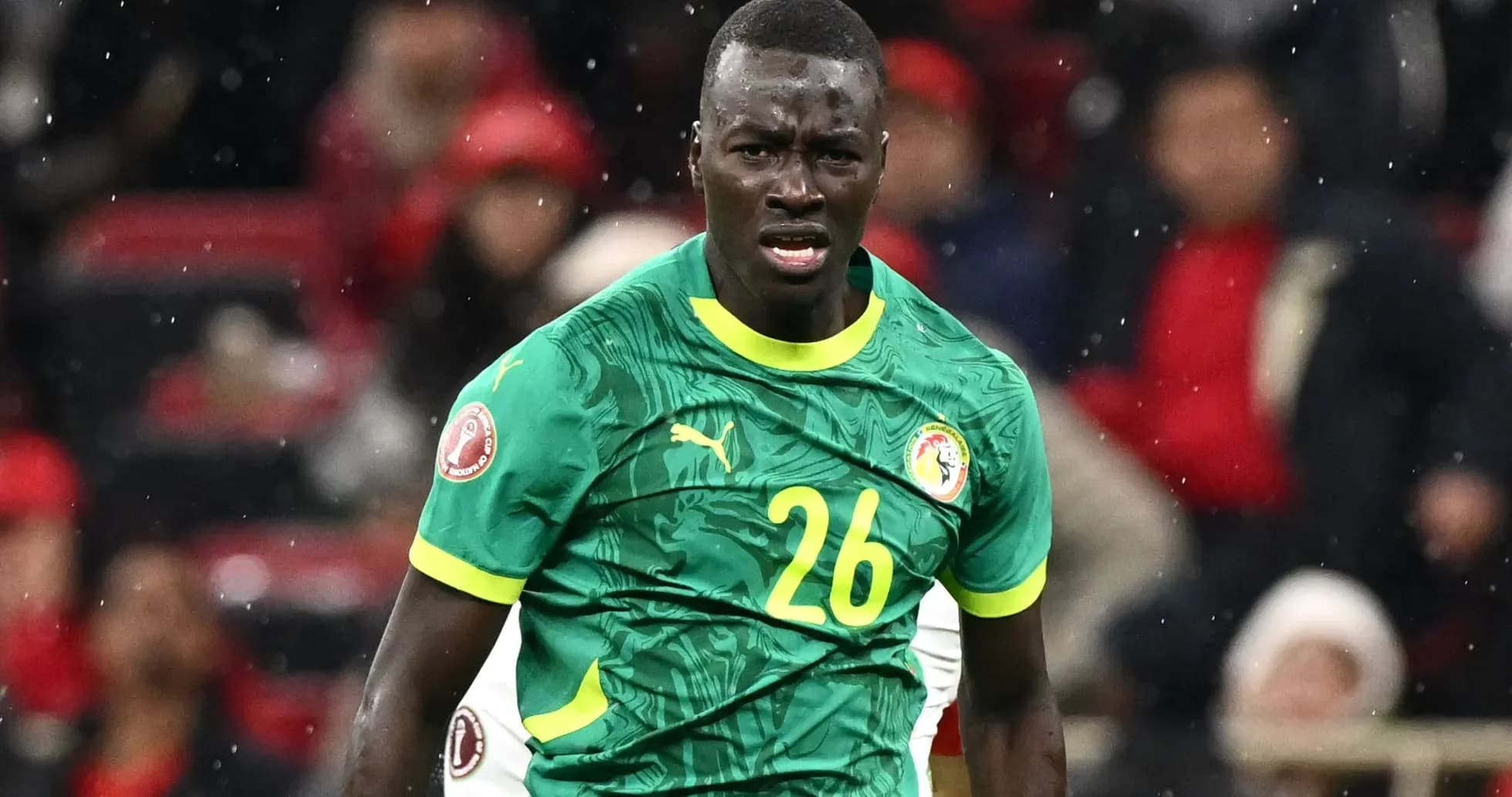 Player in green jersey reacting during football match Player in green jersey reacting during football match