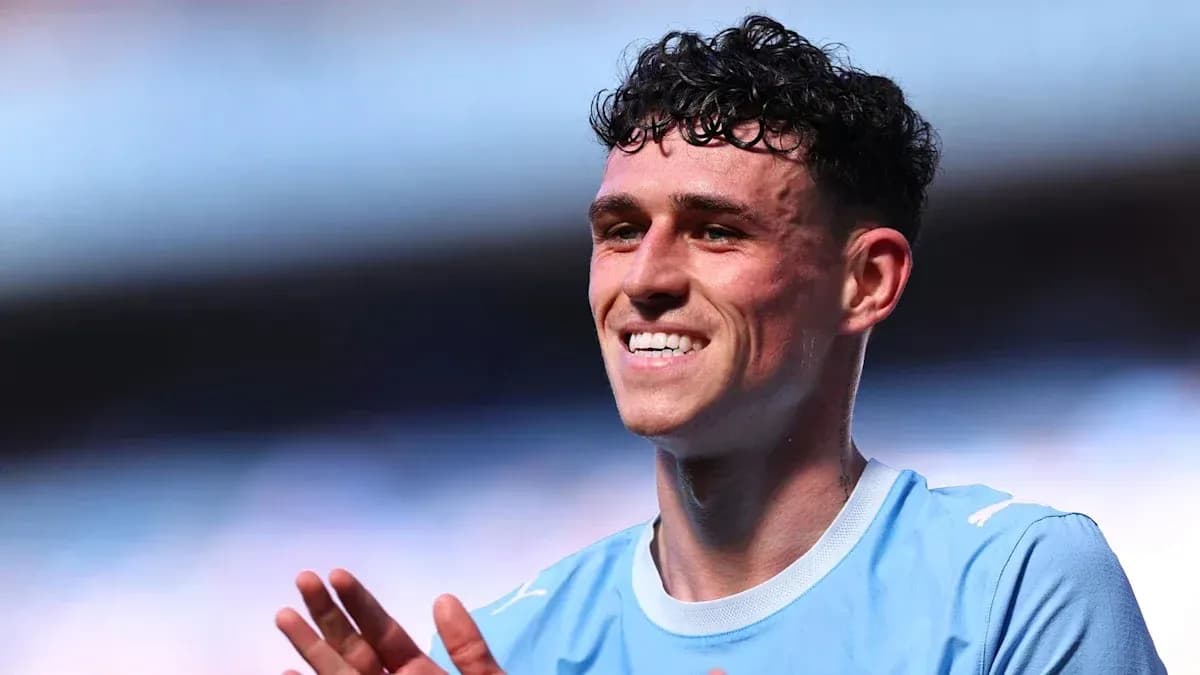 Player smiling and applauding on the field Player smiling and applauding on the field