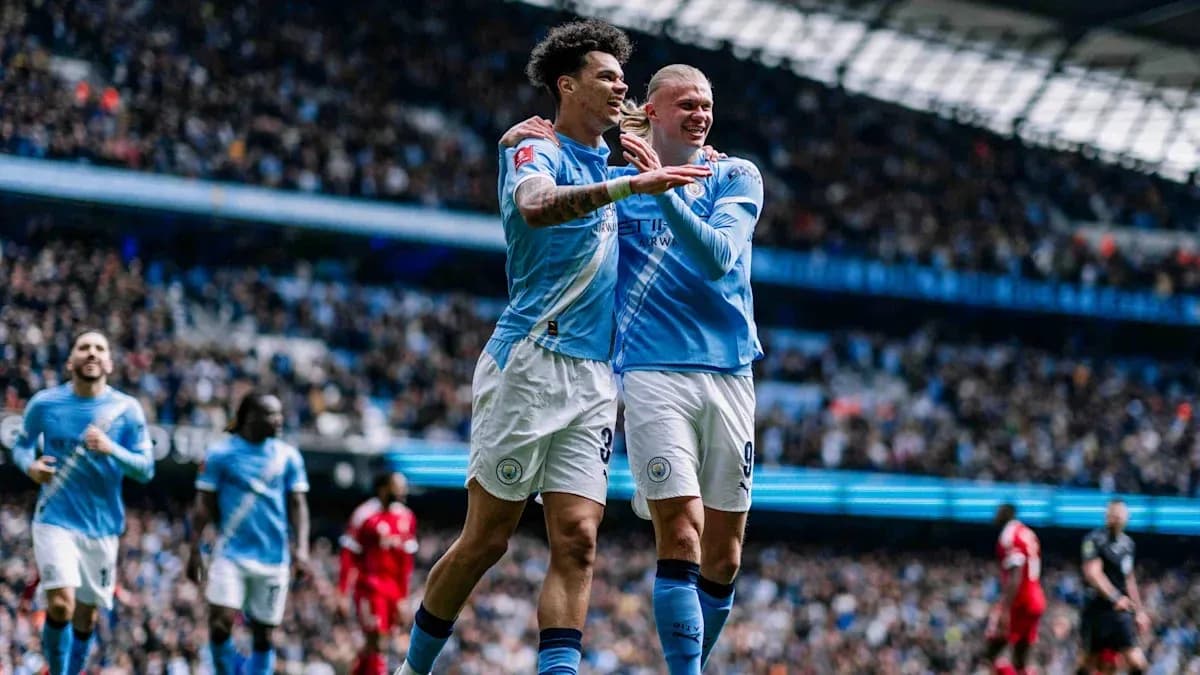 Manchester City players celebrating a goal on field Manchester City players celebrating a goal on field