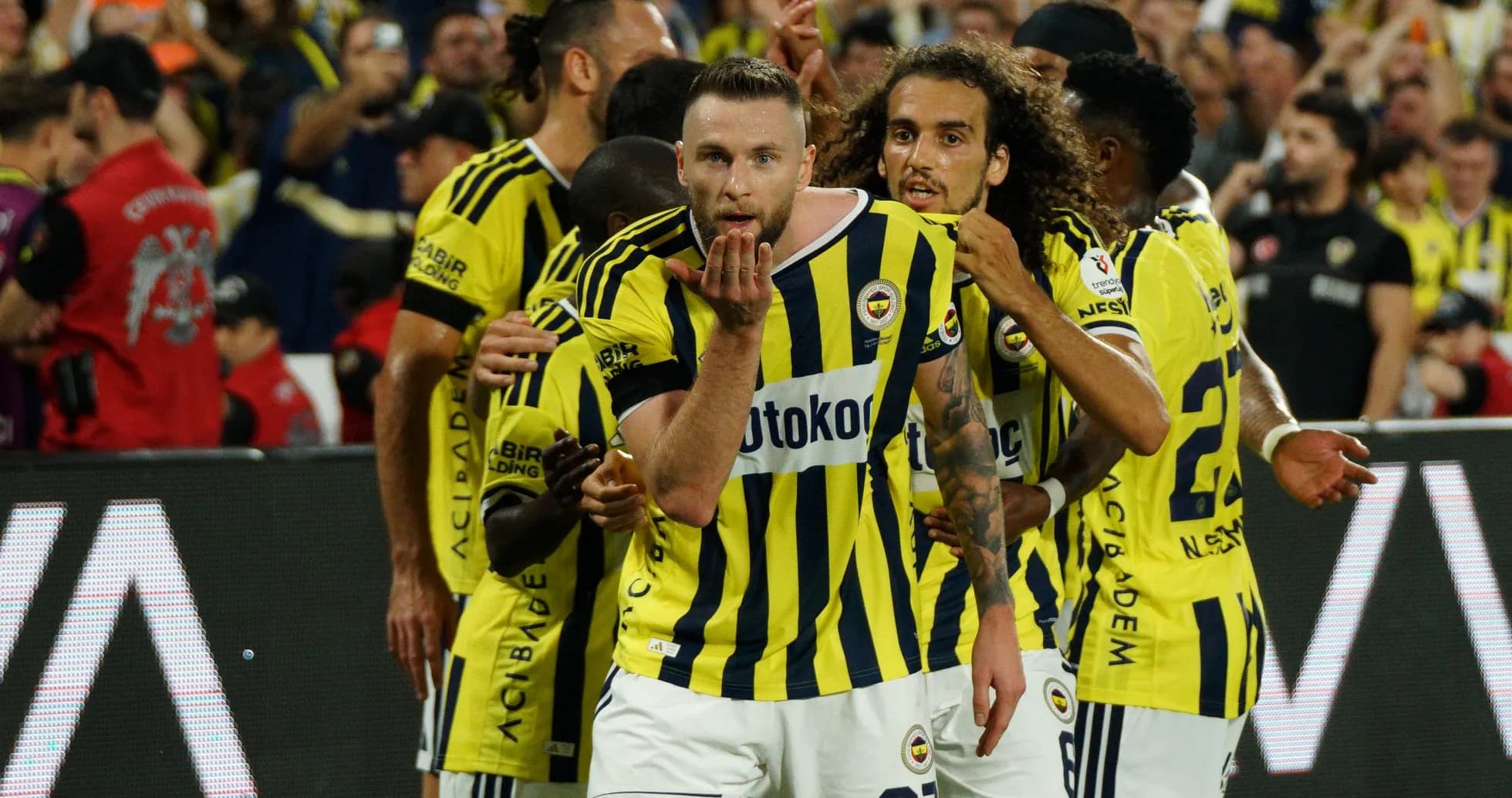 Fenerbahçe players celebrating a goal together Fenerbahçe players celebrating a goal together