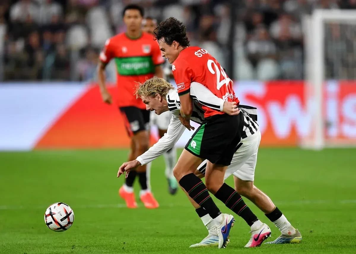 Players battling for the ball during a match Players battling for the ball during a match
