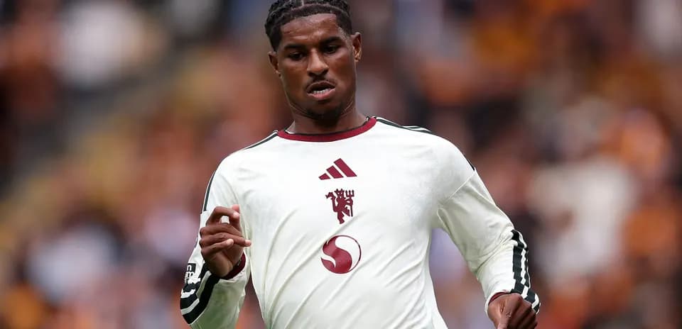 Player running during a football match Player running during a football match