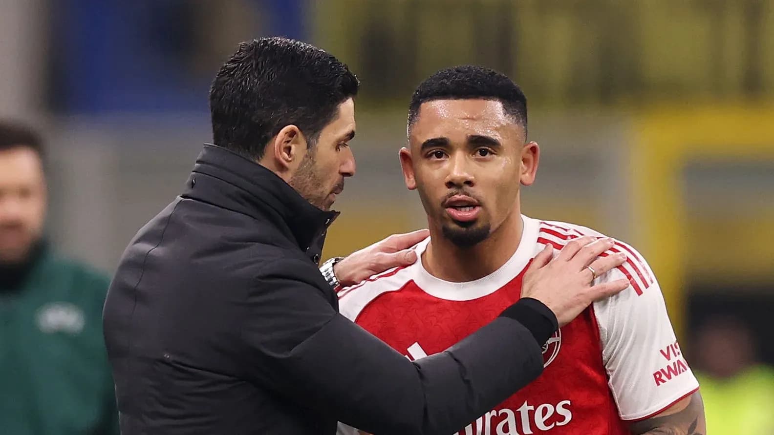 Coach discussing with player during match substitution Coach discussing with player during match substitution